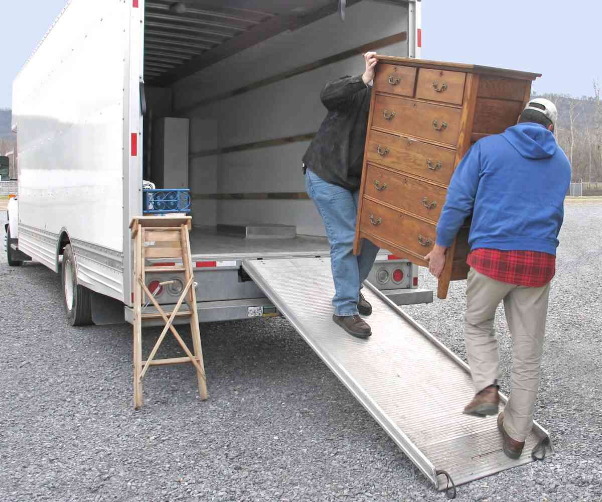 Professional movers loading furniture